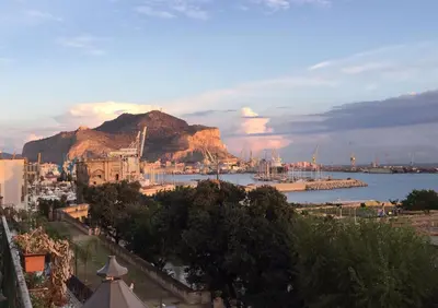 a view of a harbor with boats in the water at Amazing Sea View in Historic Building in Downtown by Wonderful Italy in Palermo