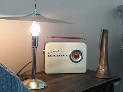 a small radio sitting on a table next to a lamp at Ad Hoc Rooms in Palermo