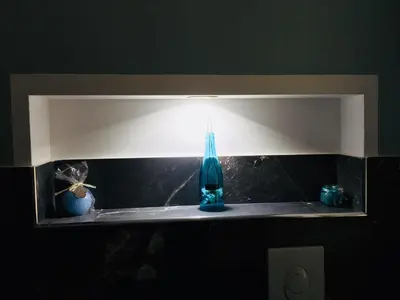 a shelf with a blue bottle and a light at Gò Gò House 2 Casa Aprile in Palermo