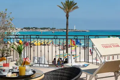 a buffet line in a restaurant with food on display at Hotel Riviera in San Vito lo Capo
