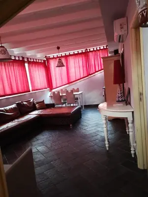a living room with a couch and a table at Locanda Re Ruggero in Monreale