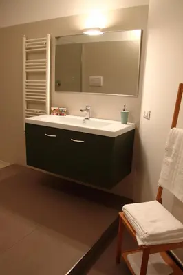 a bathroom with a sink and a mirror at Re Federico Apartment in Palermo