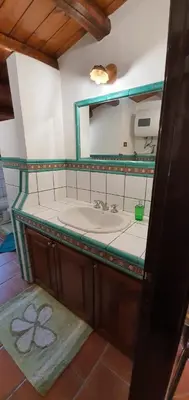 a bathroom with a sink and a mirror at 25min da Cefalù e Palermo Piscina pvt, 4camere, 150m dal mare in Trabia