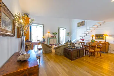 a living room with a couch and a table at Charming Apartment in the City Center by Wonderful Italy in Palermo