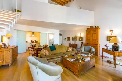 a living room with a couch and a table at Charming Apartment in the City Center by Wonderful Italy in Palermo