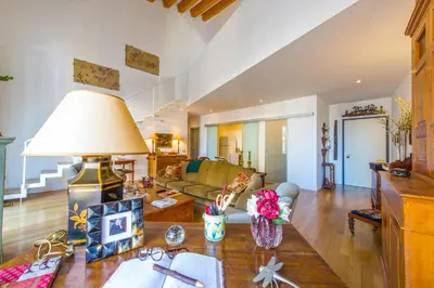 a living room with a couch and a table at Charming Apartment in the City Center by Wonderful Italy in Palermo