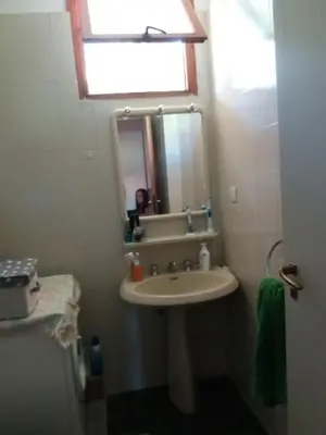 a bathroom with a sink and a mirror at Villa Hibiscus Scopello in Scopello