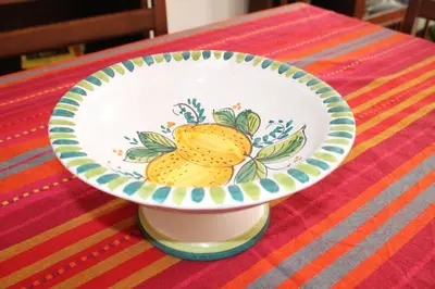 a plate with lemons on it sitting on a table at Ai Bastioni del Massimo in Palermo