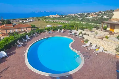 an image of a swimming pool at a resort at Riva Sea Apartments in Castellammare del Golfo