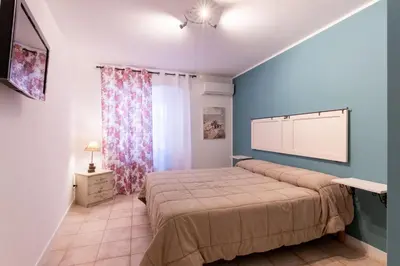 a bedroom with a large bed in a room at Arianna's House Historical Market in Palermo
