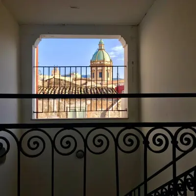 a view of a building from a balcony at Casa Vigliena in Palermo