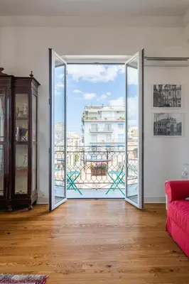 a living room with a door open to a balcony at Luxury Apartment * Immo's House* in Palermo