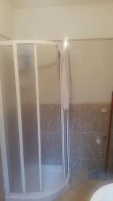 a shower with a glass door in a bathroom at Villa Aurora Per Vacanze in Palermo