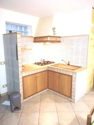 a kitchen with a sink and a stove at Villa Aurora Per Vacanze in Palermo