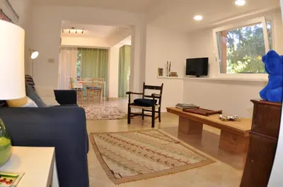 a living room with a couch and a table at Casa Frida in Palermo