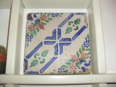 a picture of a tile on top of a shelf at Ai quattro canti di città, appartamento in centro in Palermo