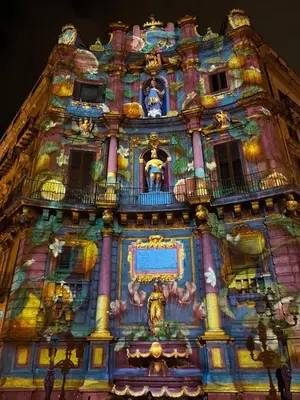 a building with a painting on the side of it at Ai quattro canti di città, appartamento in centro in Palermo