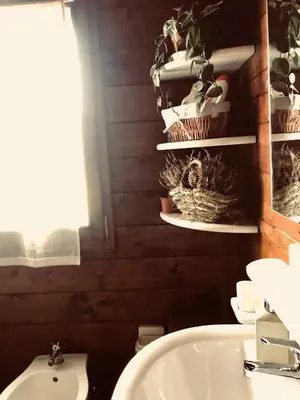 a bathroom with a white sink and a toilet at Villa Rosemada, Mondello in Palermo