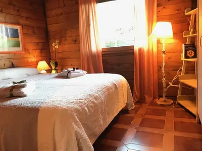 a bedroom with a white bed and a window at Villa Rosemada, Mondello in Palermo