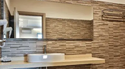 a bathroom with a sink and a mirror at Hotel Sporting Club in Altavilla Milicia