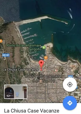 a map of a island with a red marker at La Chiusa Case Vacanze in Castellammare del Golfo