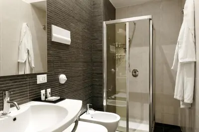 a bathroom with a sink and a shower at Palazzo Brunaccini Boutique Hotel in Palermo