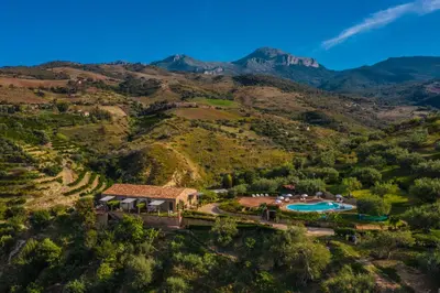an aerial view of the house and the mountains at Poggio Pozzetti in Lascari