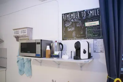 a shelf with a microwave and a coffee maker on it at Mediterraneo in Palermo