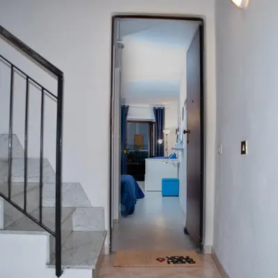 a hallway with a door leading to a living room at Mediterraneo in Palermo