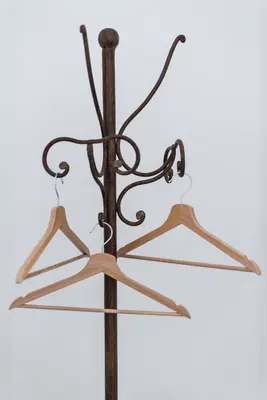 a set of three hangers on a metal pole at B&B Malvasia in Palermo