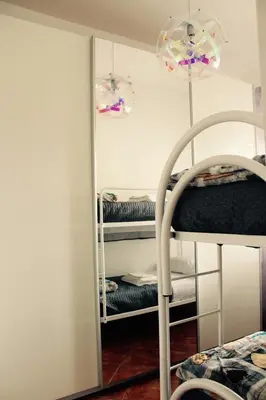 a mirror in a room with a bunk bed at Villa Aga in Campofelice di Roccella
