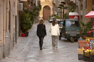 two women walking down a street at Novelli 36 in Palermo