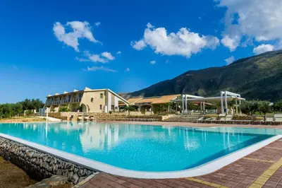 a large swimming pool in front of a building at Borgo Aranci - Villetta Peonia B3 - Castellammare del Golfo in Castellammare del Golfo