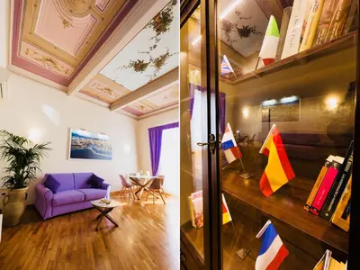 a living room with a purple couch and a table at SUITE 188 - Welcome in Palermo
