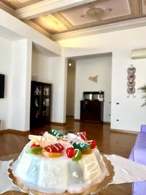 a white cake sitting on top of a table at SUITE 188 - Welcome in Palermo