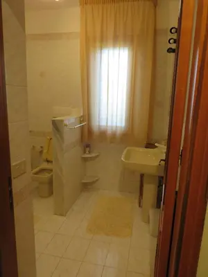 a bathroom with a sink and a toilet at Villa Paloma in Castellammare del Golfo