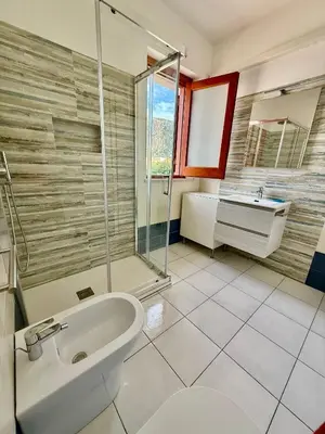 a bathroom with a sink and a shower at Yucca Apartment in San Vito lo Capo