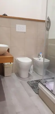 a bathroom with a toilet and a sink at Aziz b&b in Palermo