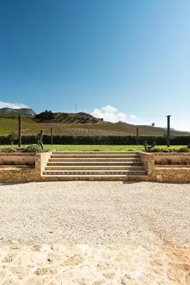a set of stone steps in a park at Tenute Baglio Passofondo in Alcamo