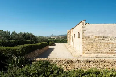 an alley in an old stone building at Tenute Baglio Passofondo in Alcamo