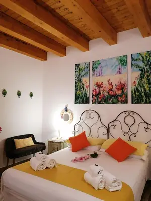 a bedroom with a bed with towels on it at Casa Busari in Palermo