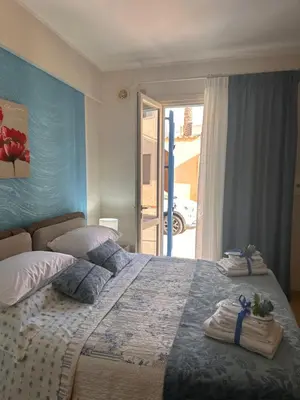 a bedroom with a large bed with towels on it at appartamento residence via giardini Acquamarina in San Vito lo Capo
