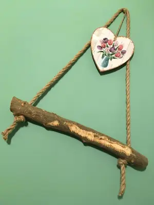 a wooden heart on a piece of wood with a stick at Ai Carrettieri della Cattedrale in Palermo