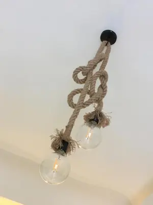 a chandelier with two lights hanging from a ceiling at Ai Carrettieri della Cattedrale in Palermo