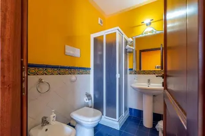 a bathroom with a toilet and a sink and a shower at Stenopus Greco Casa per AFFITTI TURISTICI in Santa Flavia