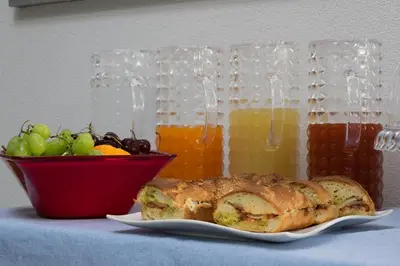 a plate with a loaf of bread and a bowl of fruit at B&B Acqua Azzurra in San Vito lo Capo