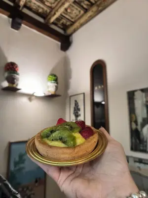 a bunch of different types of pastries on a table at Vittorio Emanuele Rooms di Prinzi in Palermo