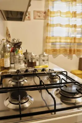 a stove top with four burners on top of it at Casa Palazzo Reale in Palermo