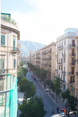 a view of a street in a city with buildings at Aria Rooms in Palermo