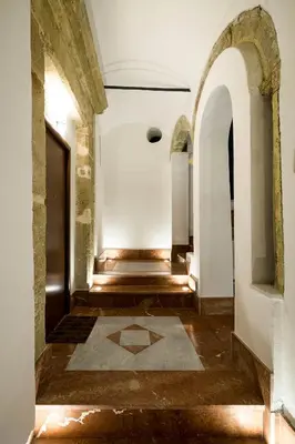 an empty hallway with a tile floor in a building at Penthouse Luxury Quattro Canti in Palermo